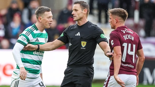 EDINBURGH, SCOTLAND - OCTOBER 26: Celtic's Callum McGregor (L) and Hearts' Cammy Devlin are separated by referee Steven McLean during a William Hill Premiership match between Heart of Midlothian and Celtic at Tynecastle Park, on October 26, 2025, in Edinburgh, Scotland. (Photo by Craig Williamson/SN