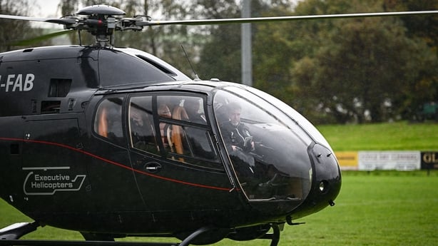 26 October 2025; The helicopter carrying Shamrock Rovers manager Stephen Bradley and Shamrock Rovers assistant coach Glenn Cronin after they ran the Dublin Marathon today, lands at City of Derry Rugby Football Club before the SSE Airtricity Men's Premier Division match between Derry City and Shamroc